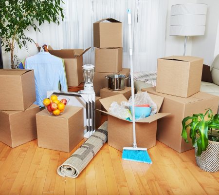 Moving boxes in new apartment. Real estate concept.